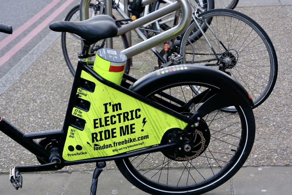 yellow and black bicycle with black wheel