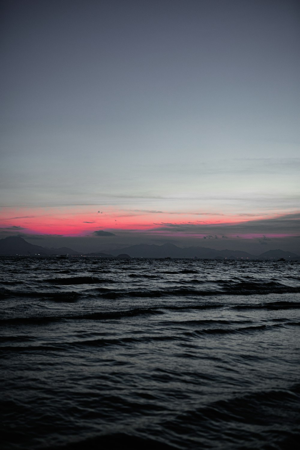 body of water during sunset