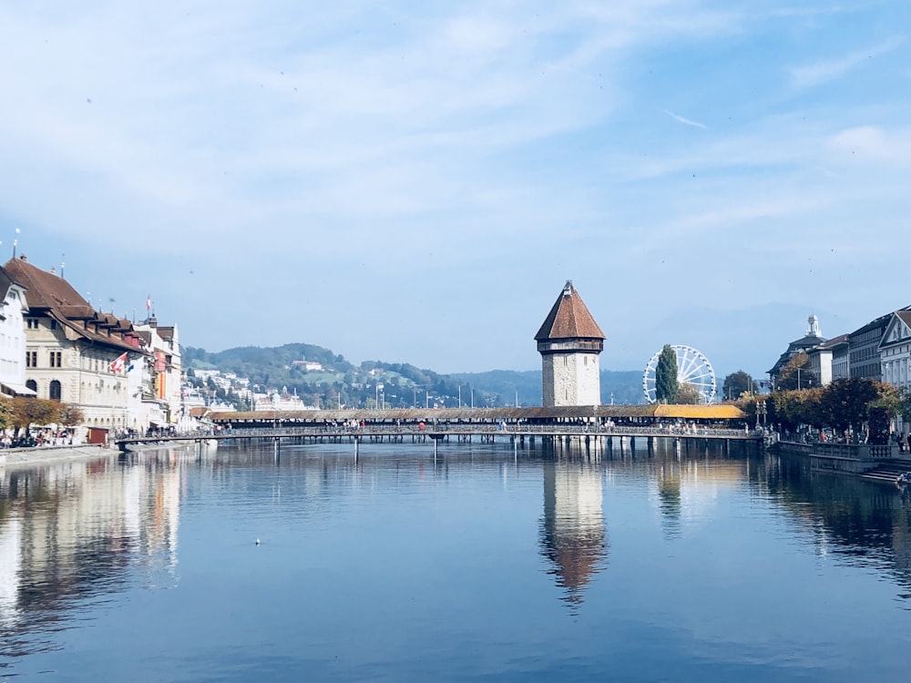 white and brown concrete building near body of water during daytime