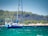 Sailboat anchored in a turquoise Ionian bay with a 3D printed replacement part installed on the rigging.