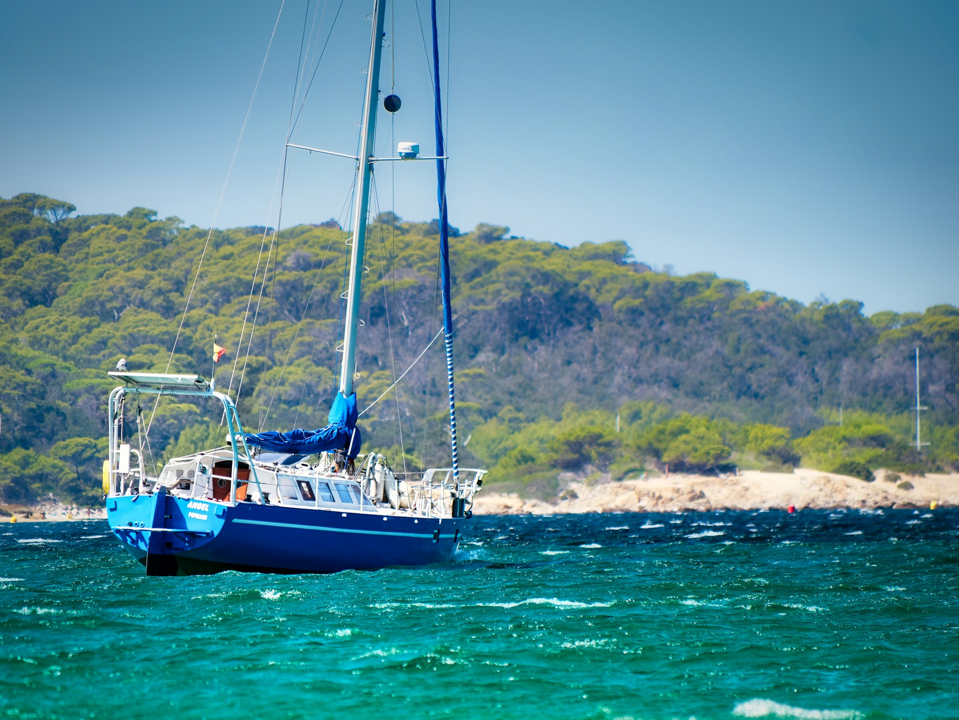 white sail boat on sea during daytime