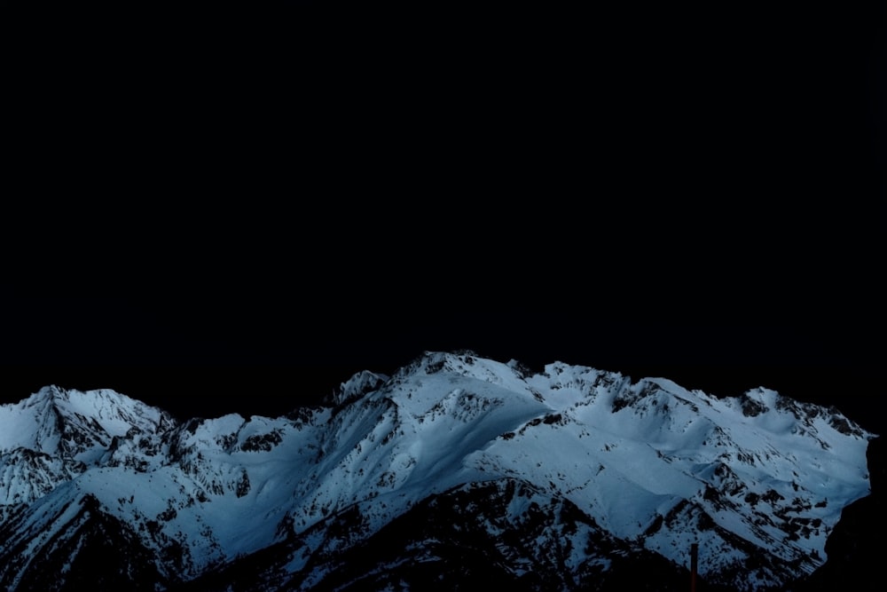 snow covered mountain during daytime