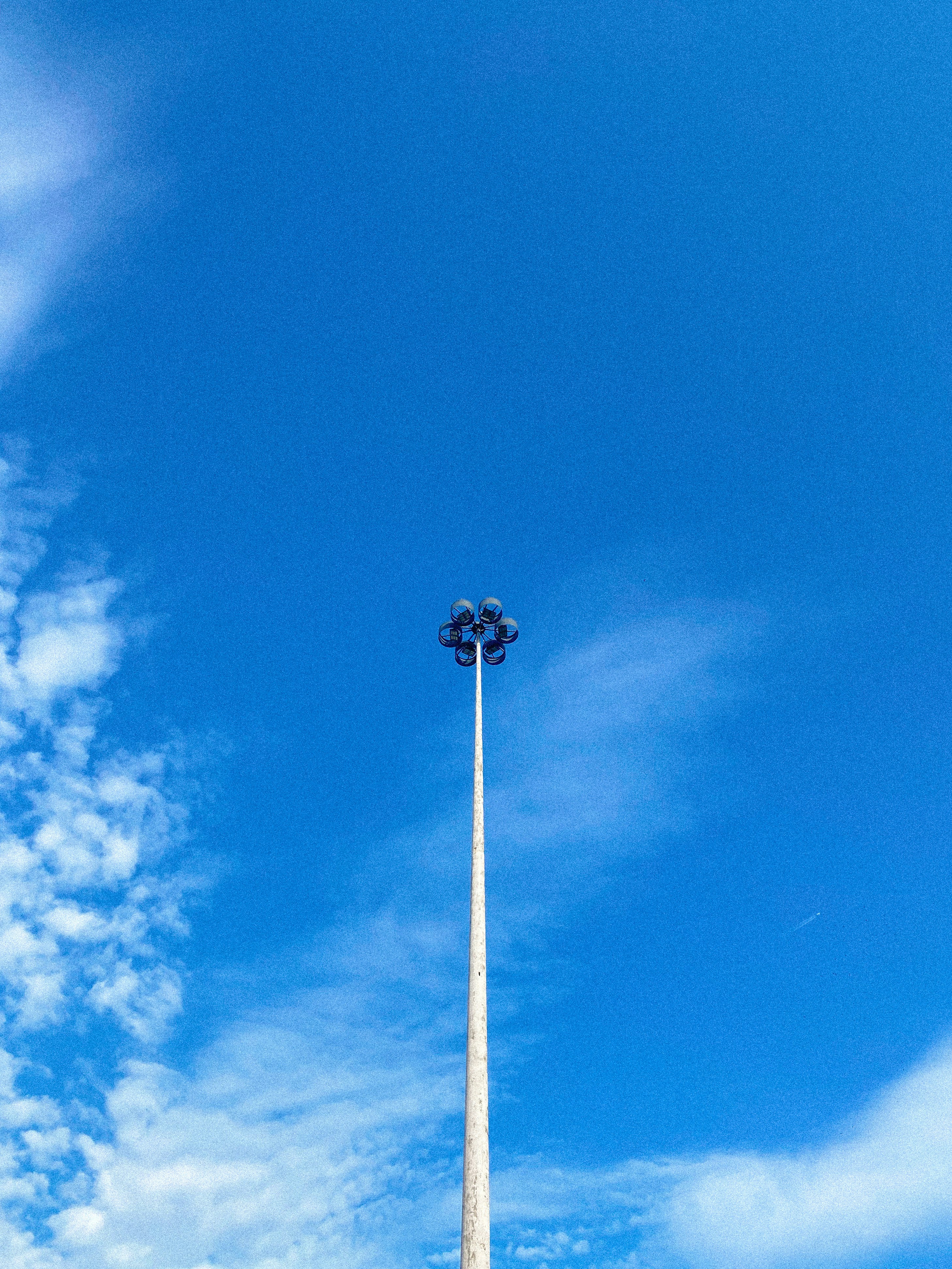 black street light under blue sky during daytime