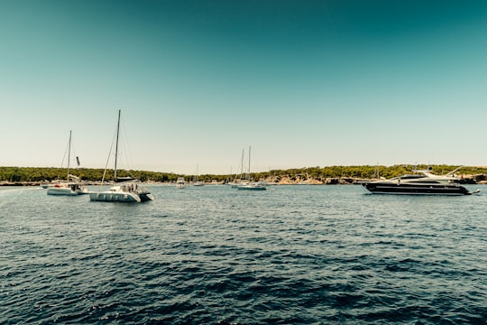 white boat on sea during daytime in Ibiza Spain