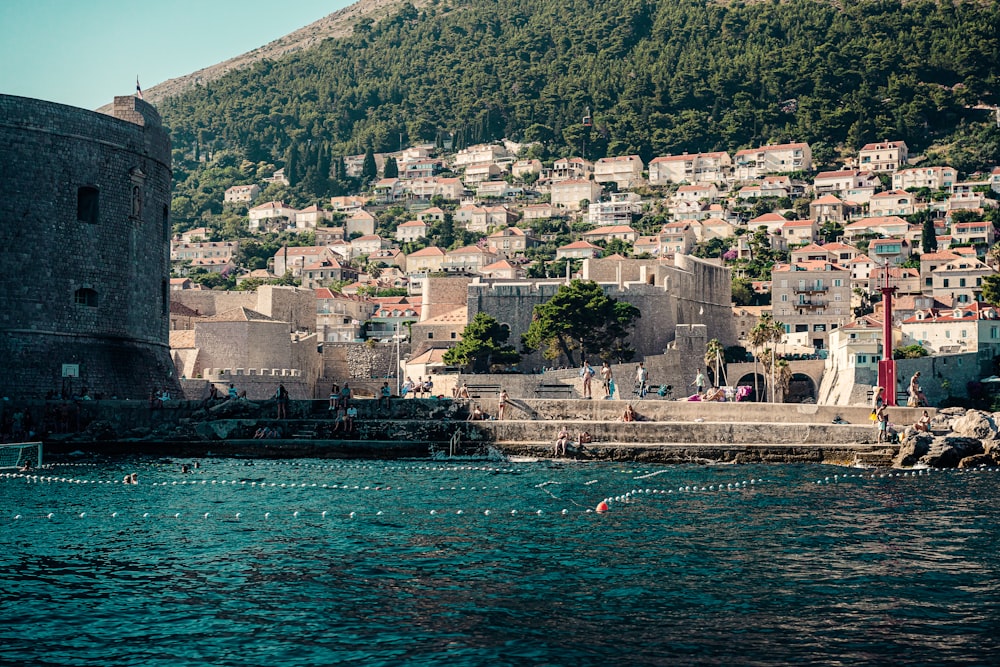 city buildings near body of water during daytime