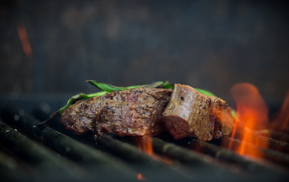 grilled meat with green leaf on top