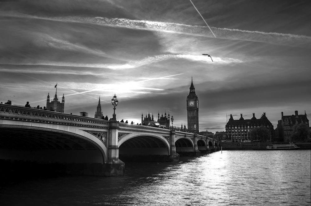 grayscale photo of bridge over river