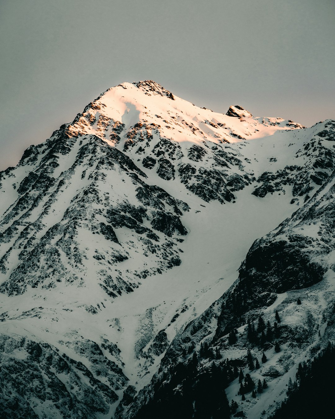 snow covered mountain during daytime