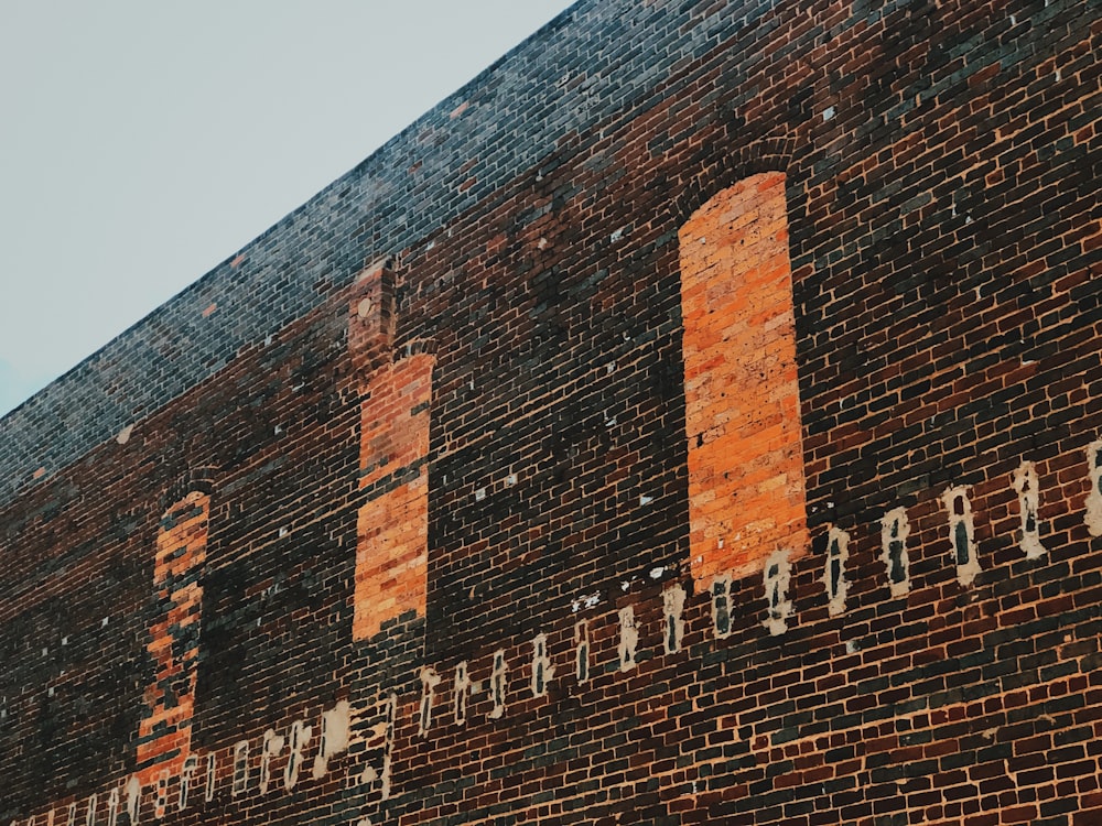 brown brick building under blue sky during daytime