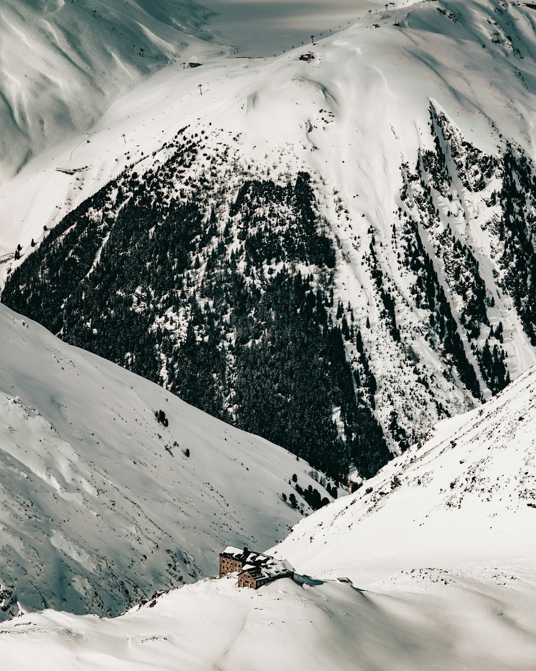 snow covered mountain during daytime