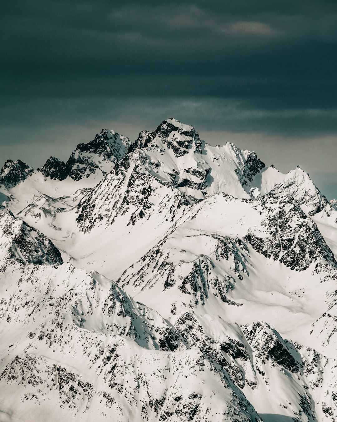 snow covered mountain during daytime