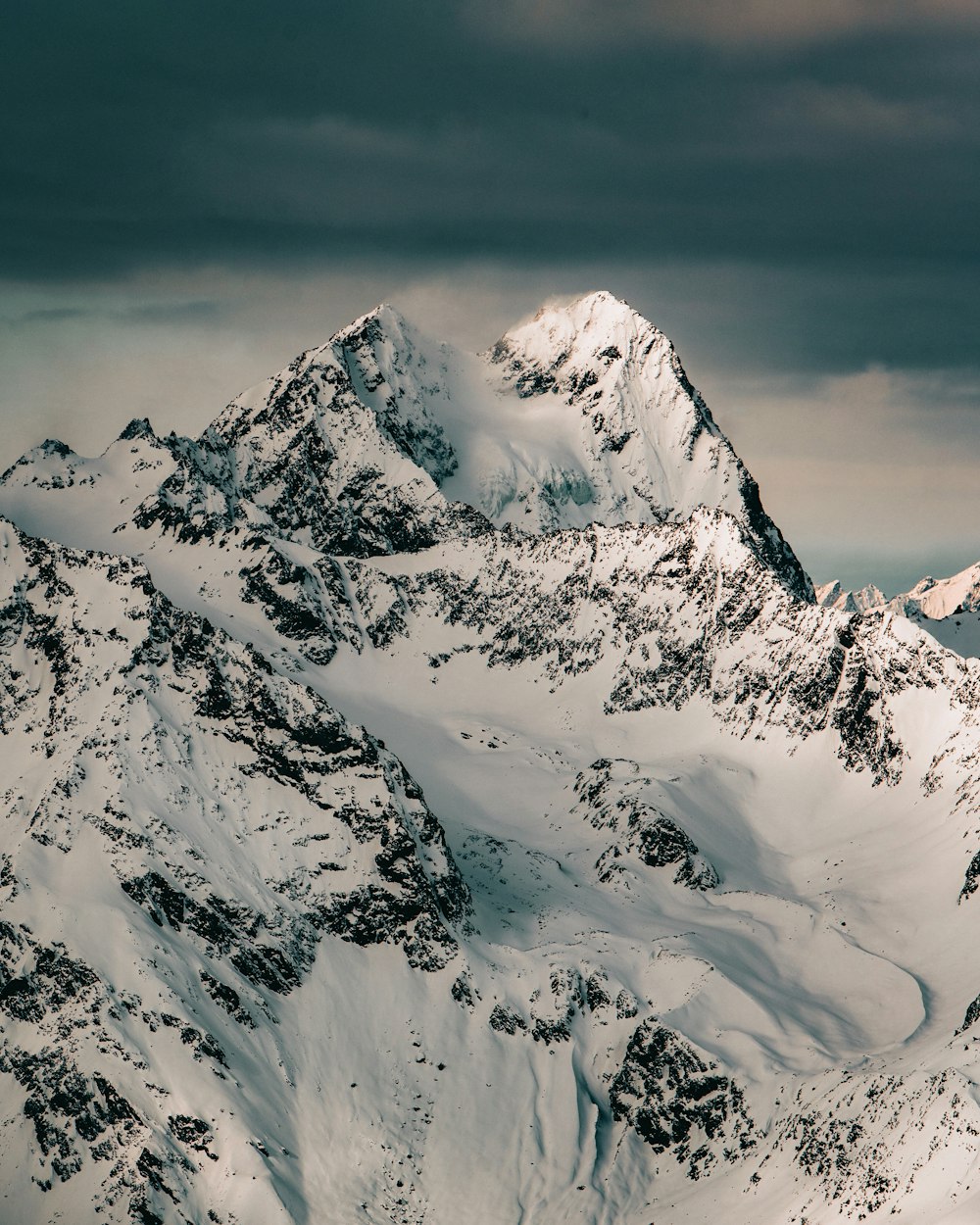 snow covered mountain during daytime