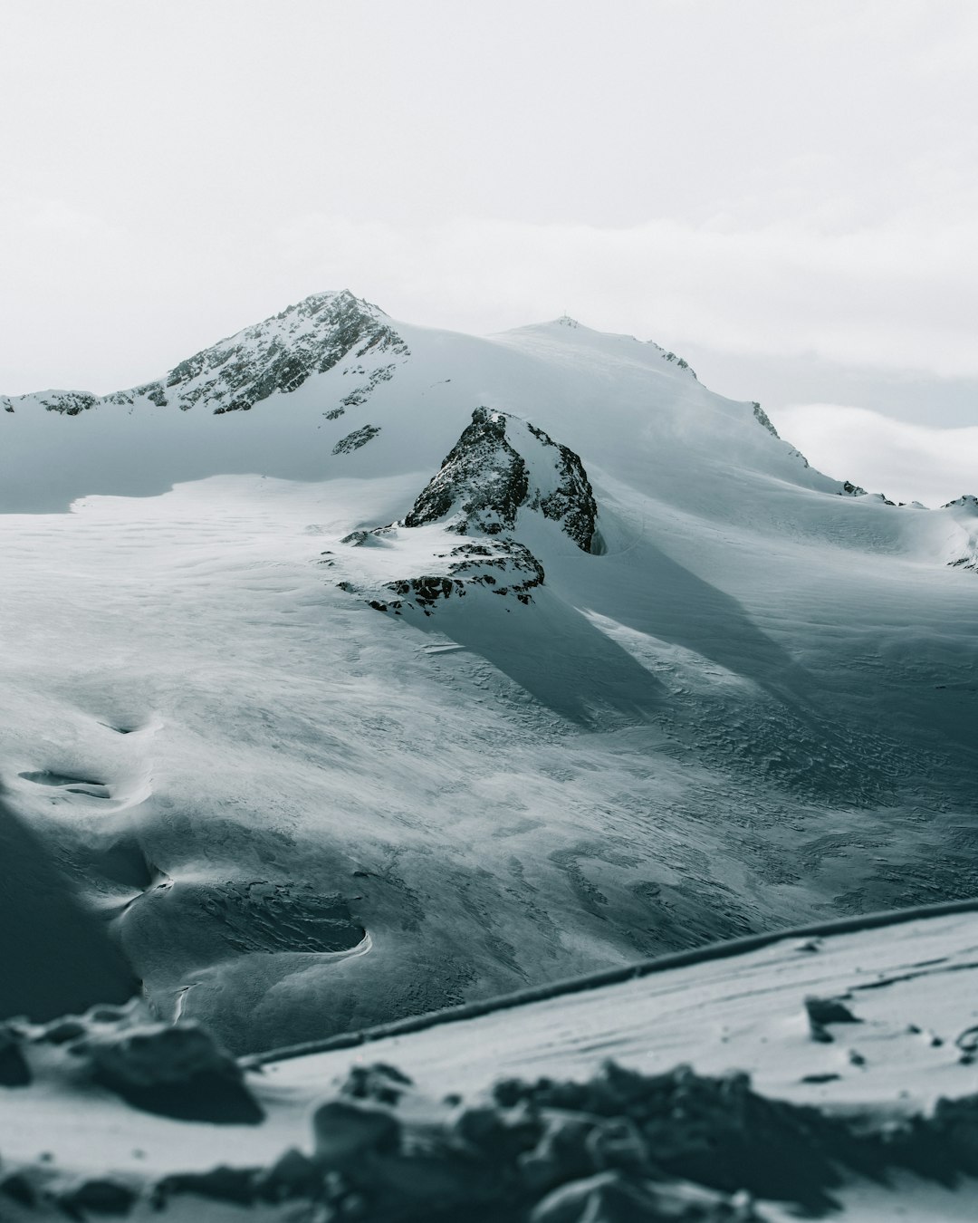 snow covered mountain during daytime