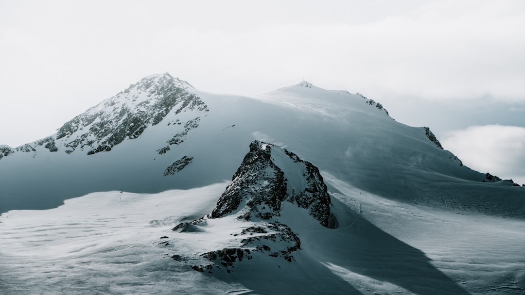 snow covered mountain during daytime