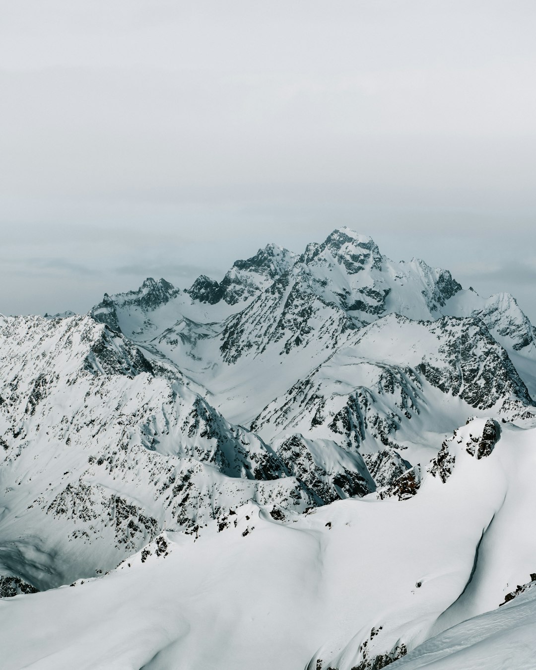 snow covered mountain during daytime