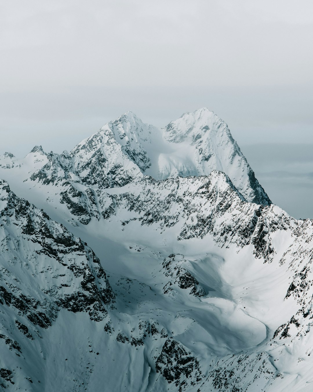 snow covered mountain during daytime