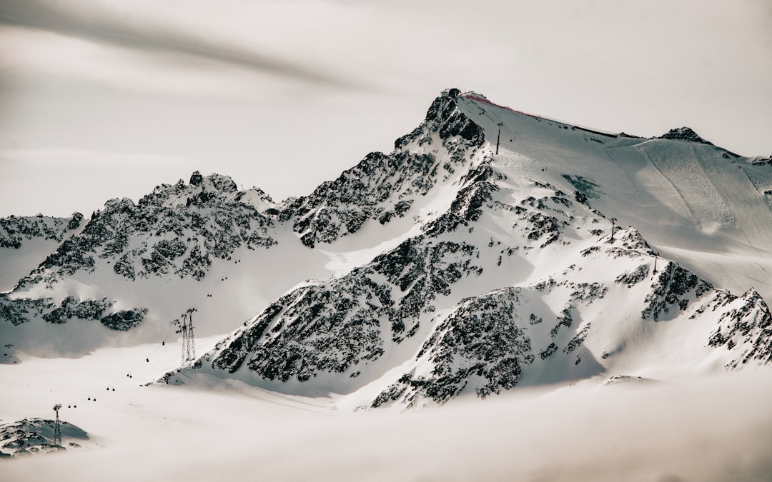 snow covered mountain during daytime