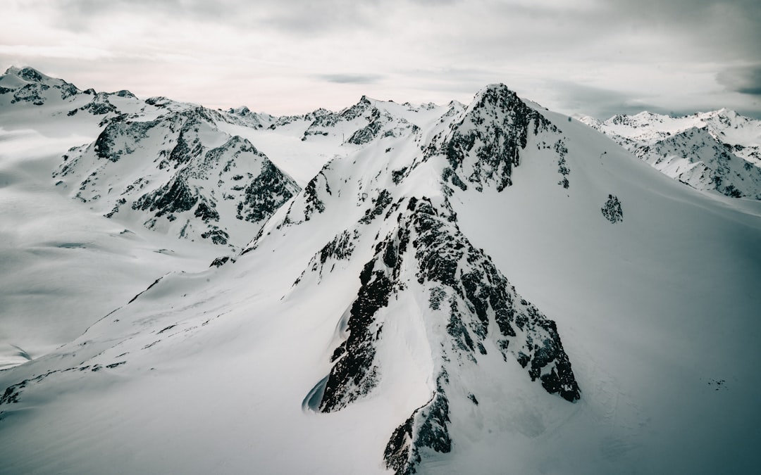 snow covered mountain during daytime