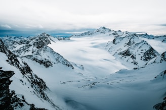 snow covered mountain during daytime