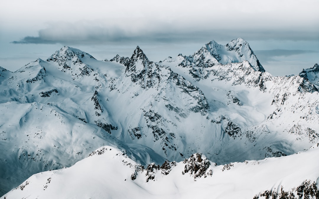 snow covered mountain during daytime