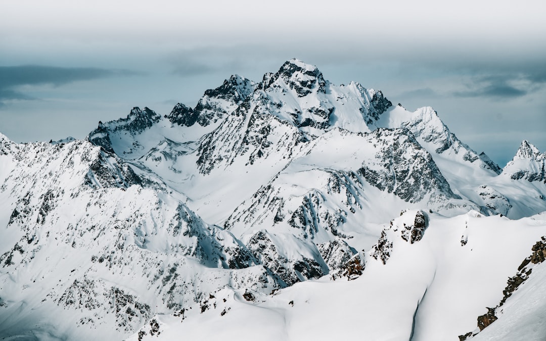 snow covered mountain during daytime