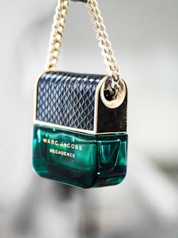 A luxurious black and gold perfume bottle.