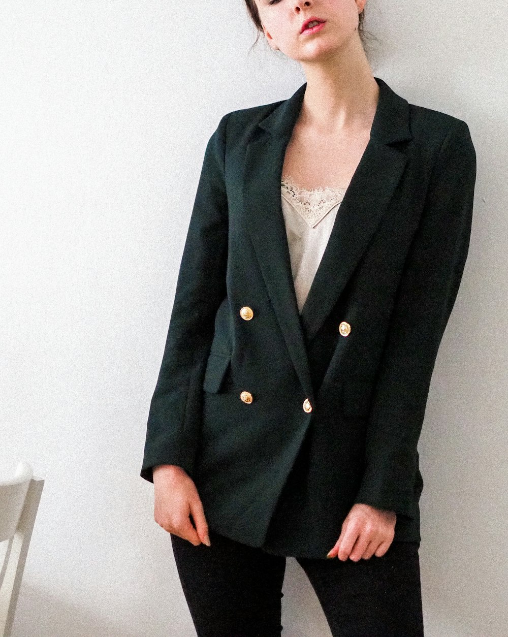 woman in black blazer standing