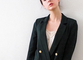 woman in black blazer standing