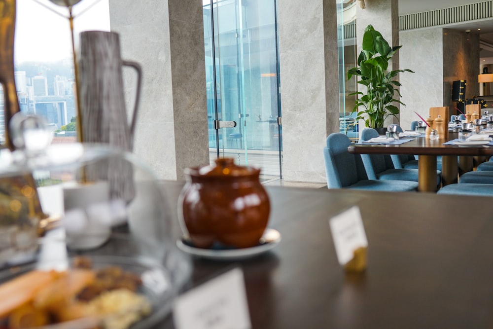 brown ceramic teapot on table