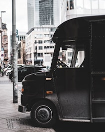 black van on the street during daytime