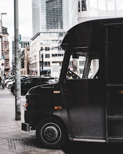 black van on the street during daytime