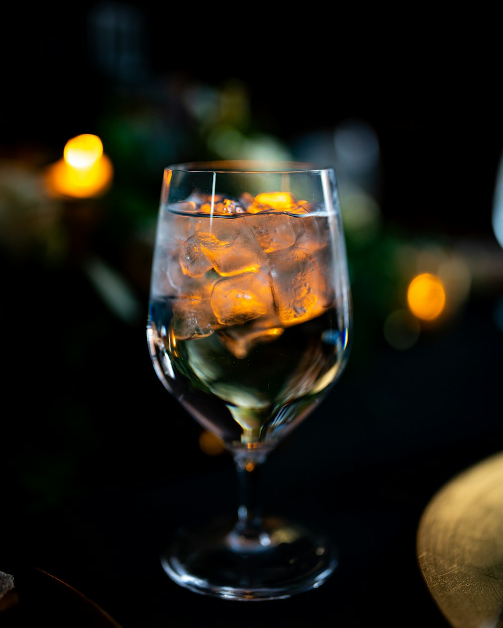 clear wine glass with yellow liquid