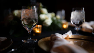 An elegant VIP table setup with glowing candles and chilled drinks ready for guests.