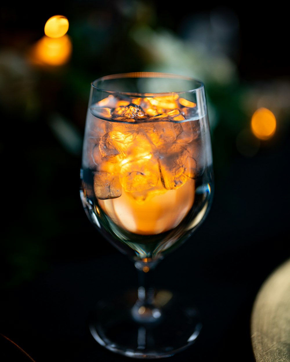 clear wine glass with yellow liquid