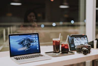 A relaxed workspace of Backstage Assets with Android tablets and coffee, capturing creative vibes.