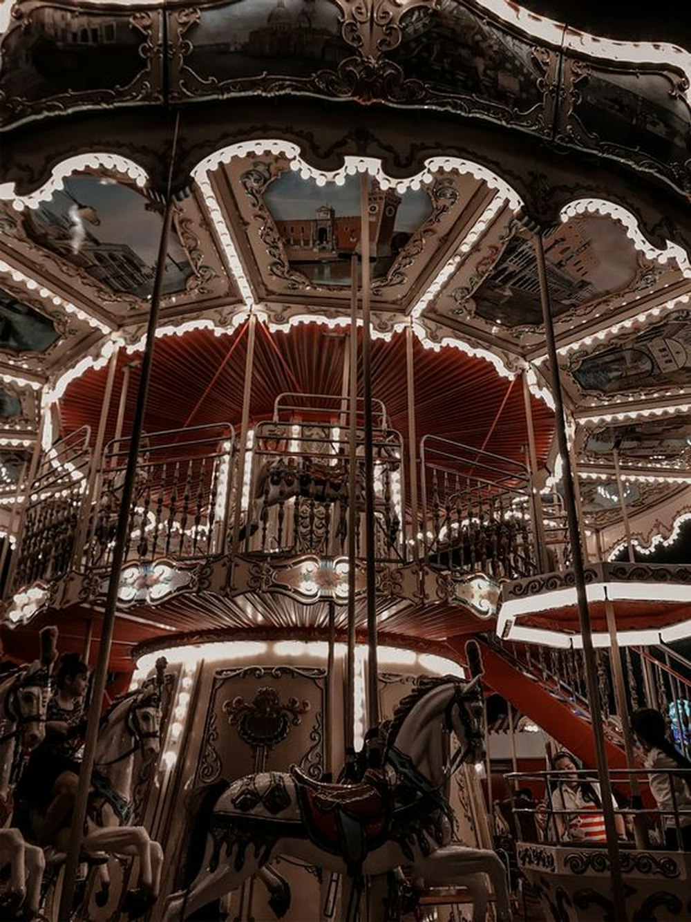 red and white carousel with lights