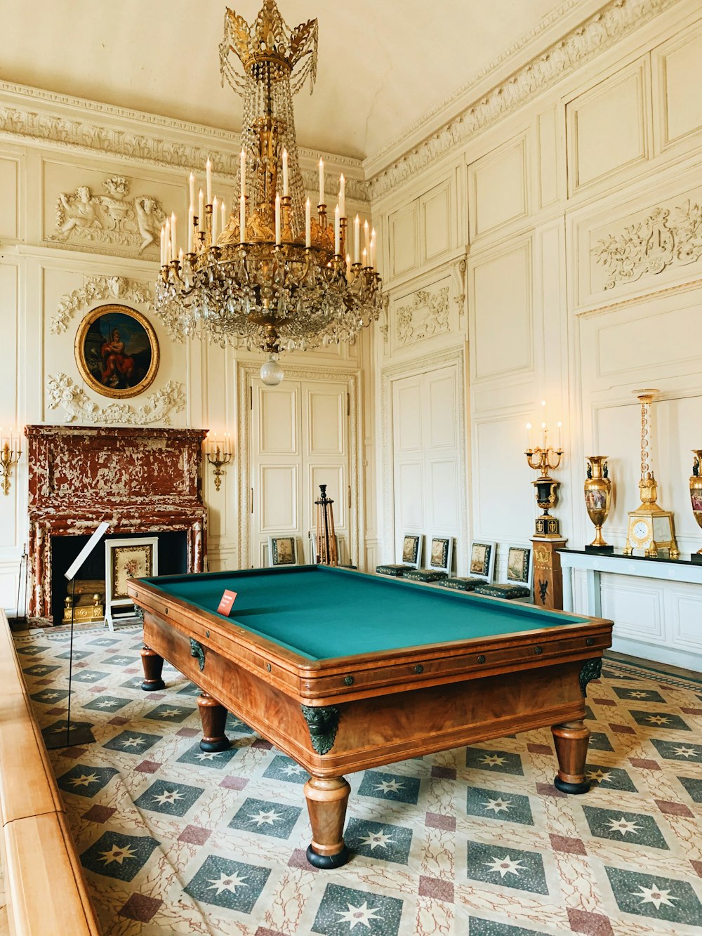 brown wooden billiard table near brown wooden chair