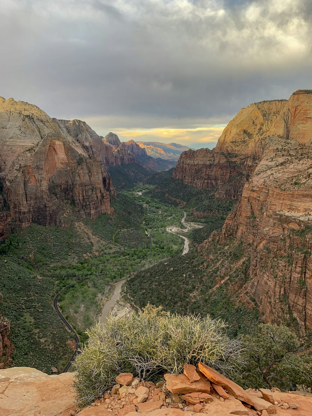 brown and green mountains under white cloudy sky during daytime