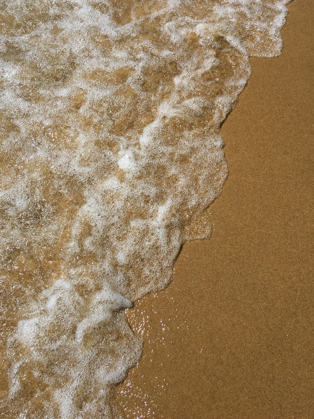 white and brown sand on brown sand