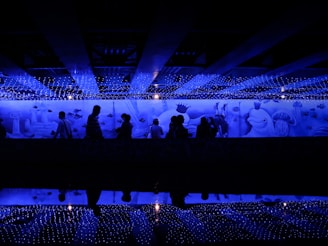 A warm, inviting therapy room decorated with aqua blue walls and playful sea animal murals to inspire and comfort children.