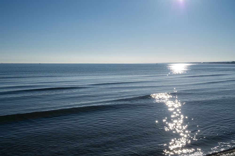 blue ocean water under blue sky during daytime