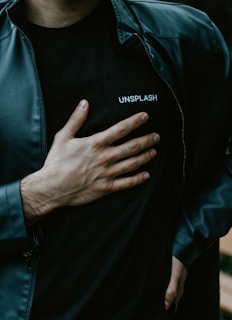 man in black adidas zip up jacket