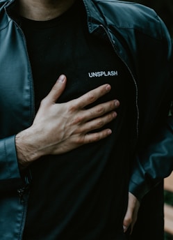 man in black adidas zip up jacket