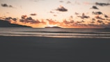 A breathtaking sunset over a tranquil beach.
