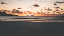 A breathtaking sunset over a tropical beach, inviting wanderlust.