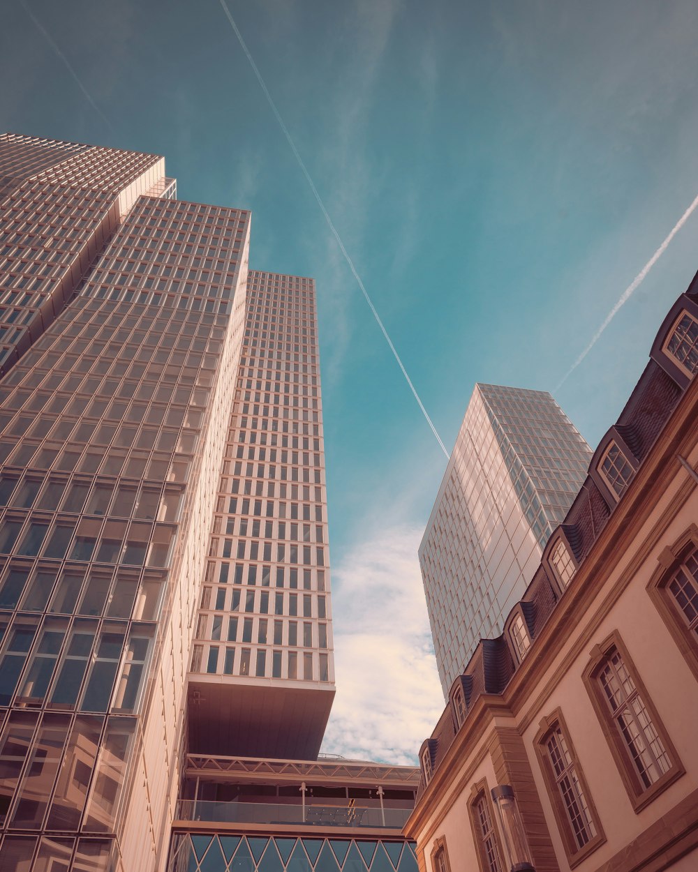 low angle photography of high rise buildings under blue sky during daytime