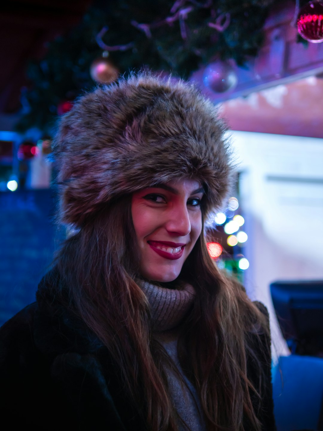 woman in black jacket smiling