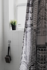 A stylish collection of shower curtains and mats.