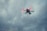 A drone equipped with thermal imaging flying over a disaster site.