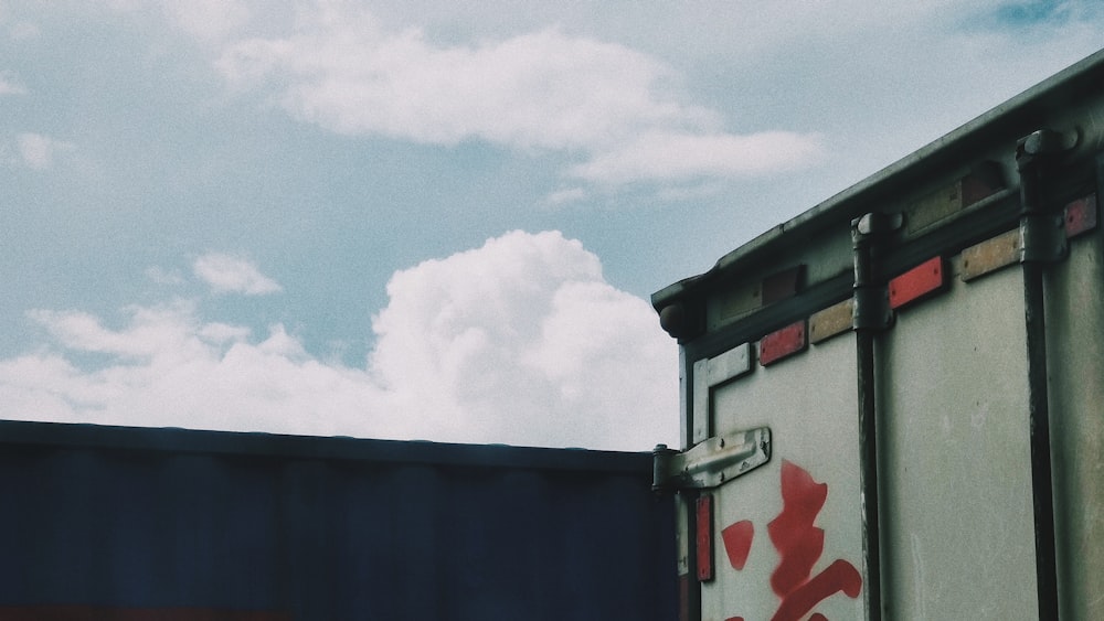 white clouds over red and white building